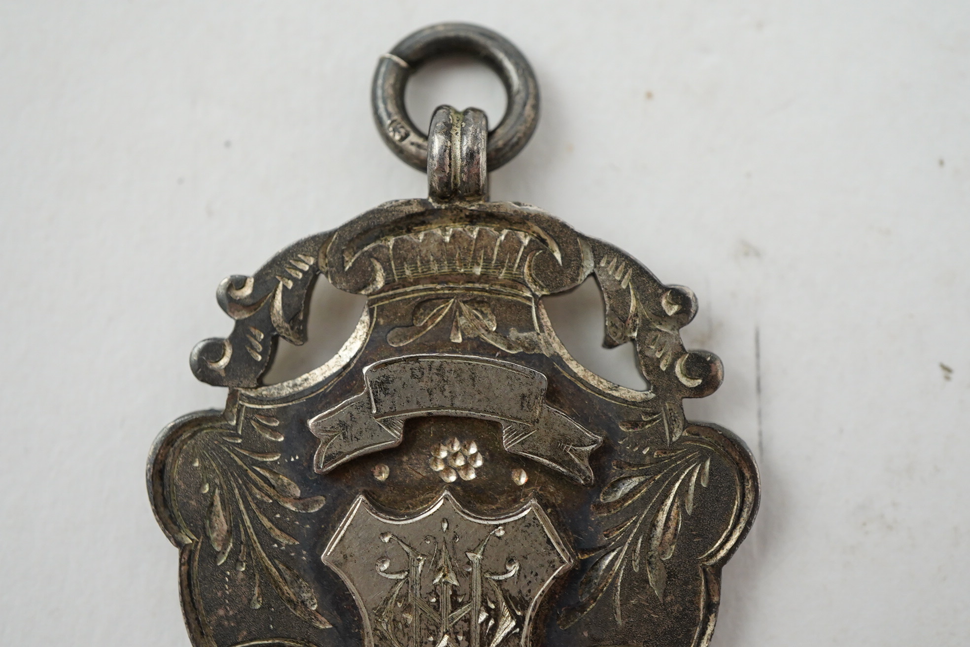 Aston Villa Football Club interest :, a late Victorian silver football medal, inscribed 'B & D.F.L. Championship, Aston Villa F.C. Runners Up 1897/98, W. Hagart [sic]', makers S.A.M., Birmingham, 1897, 44mm, in case of i